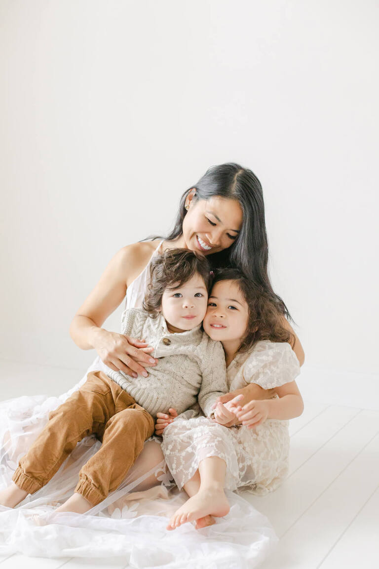 Image of a mother with her children in a studio for the Birmingham Mom Collective