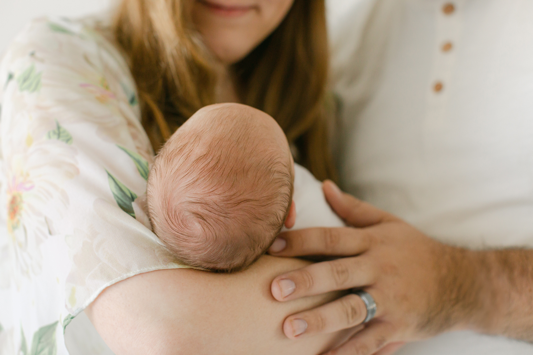 newborn photography in birmingham alabama with mom and dad and tiny new baby's head