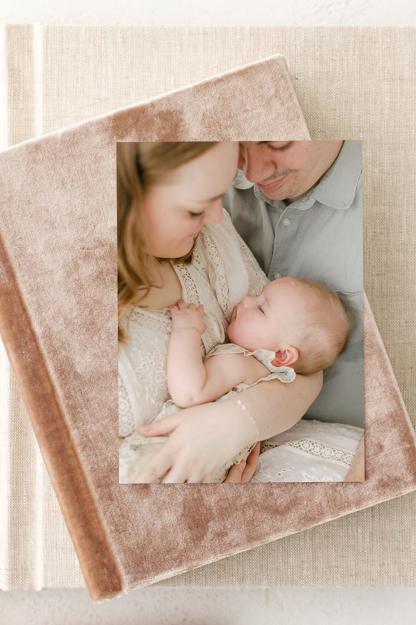 image of fine art albums to be enjoyed at home after your newborn photography session in Montgomery al
