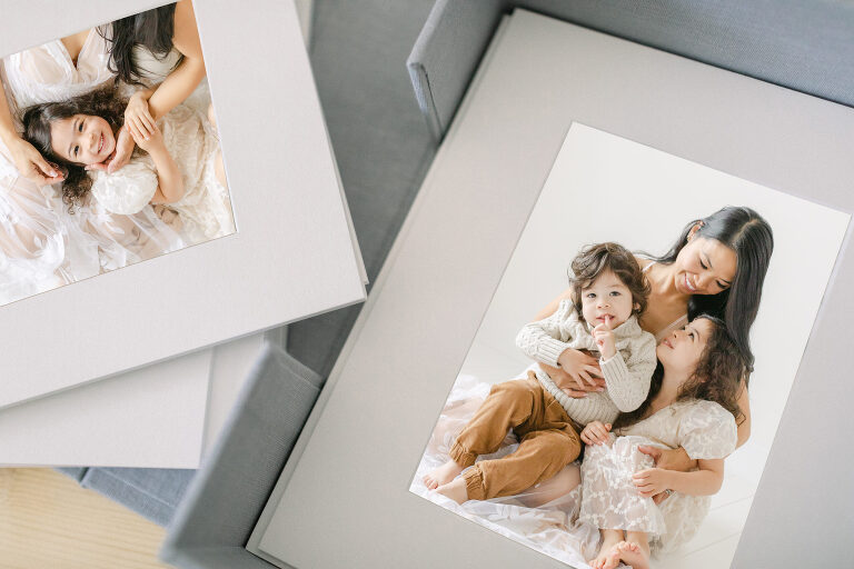 image of fine art matted prints delivered in linen box ready to be framed at home after your family photographer session in central Alabama
