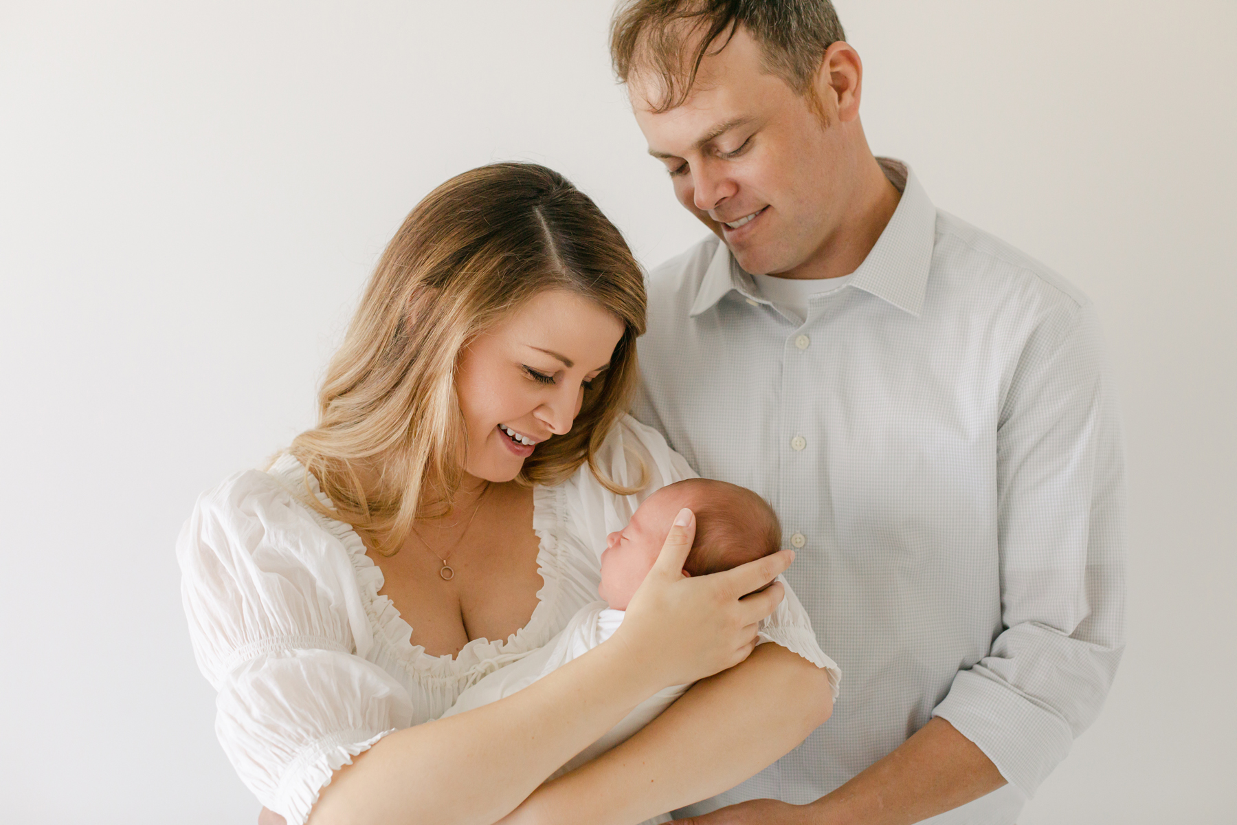 a sweet new family of three in birmingham family photographer Virginia Schultz's studio