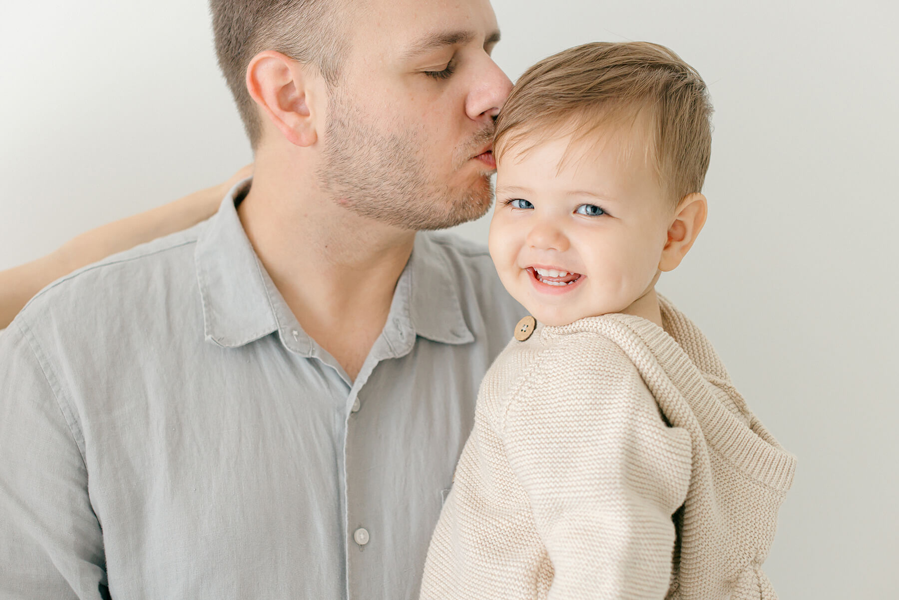 Dad and boy share special moment during their bellevue family photography session