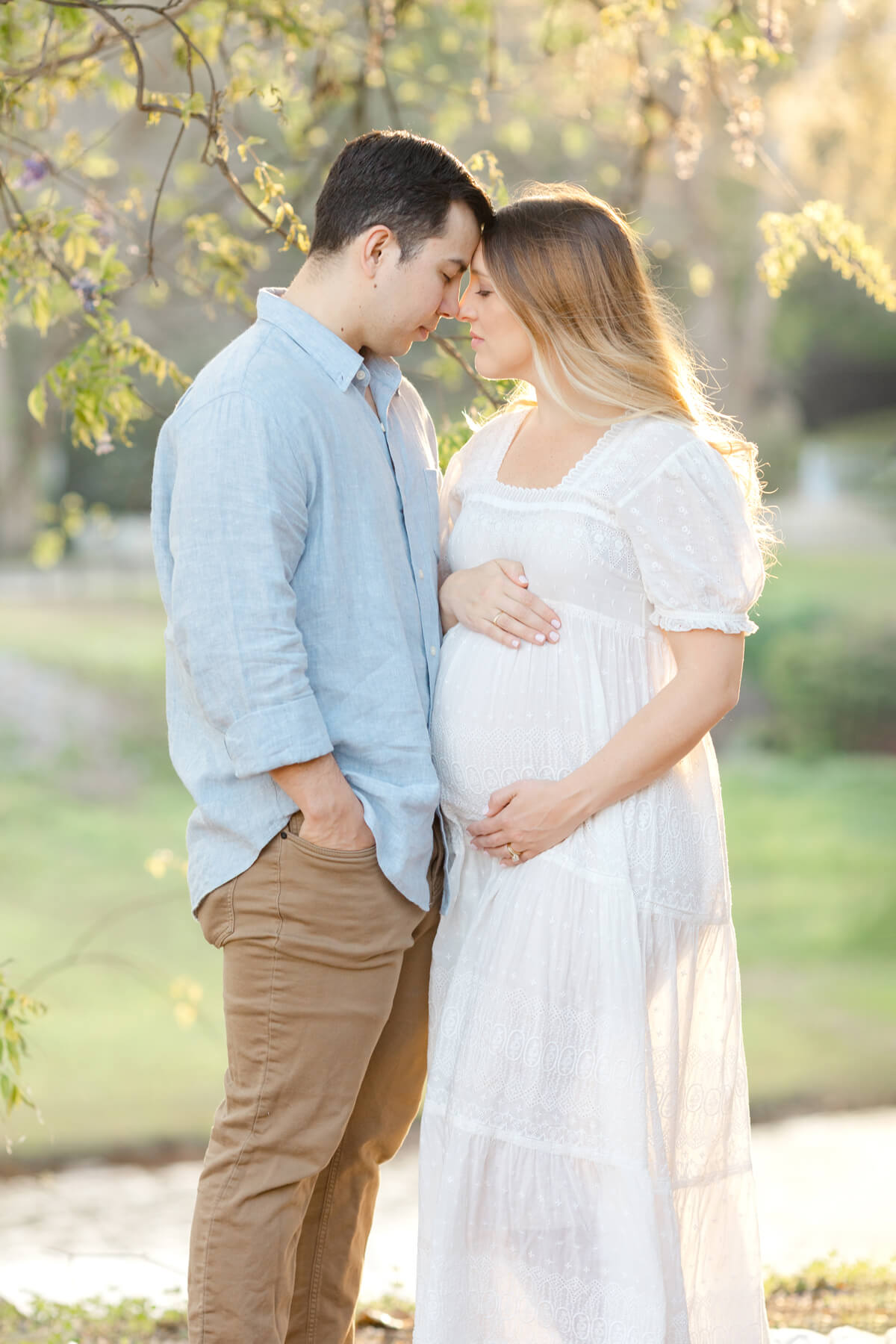 couple outdoor during spring for maternity images in omaha ne