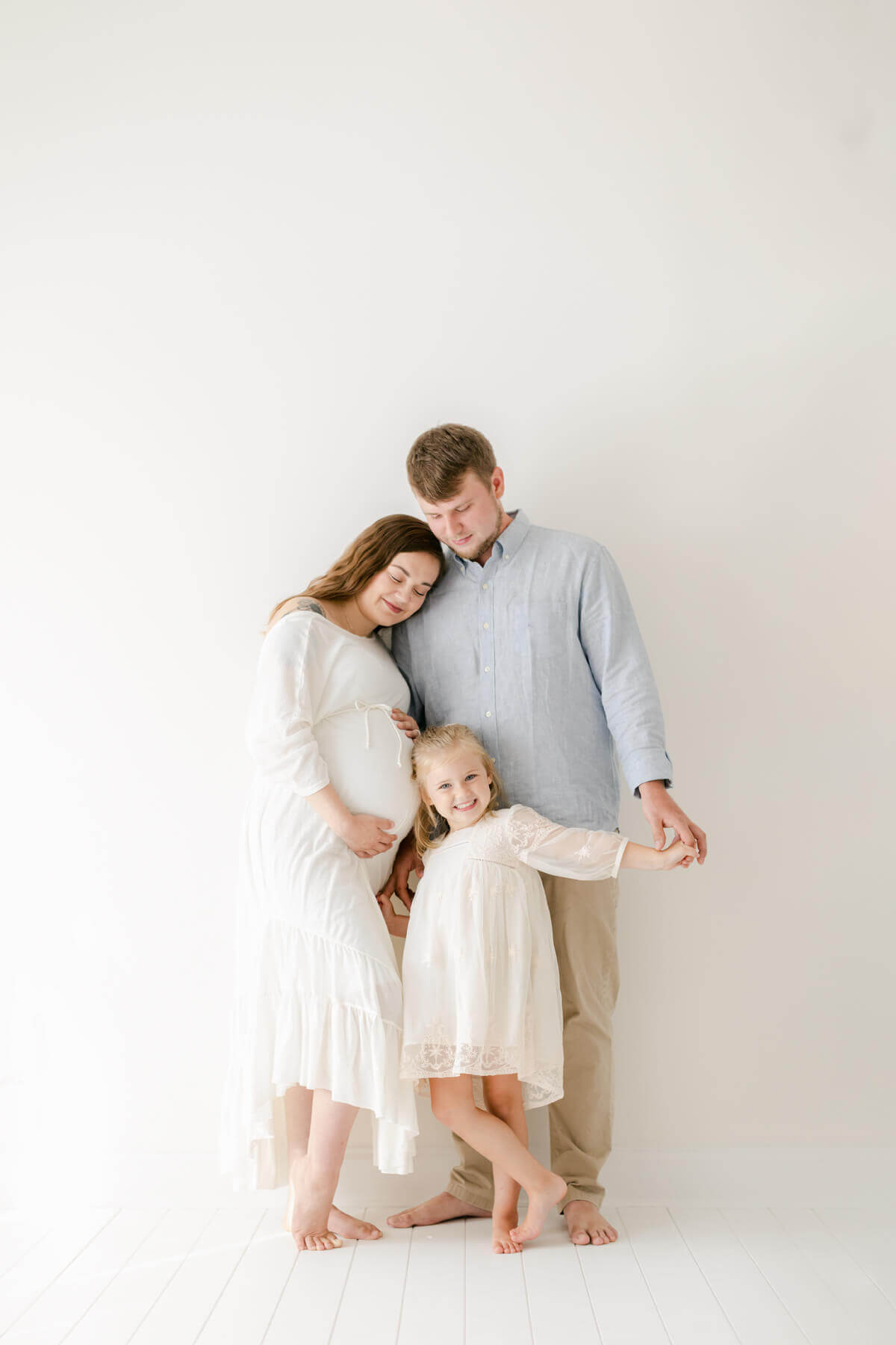 family maternity photography session with little girl