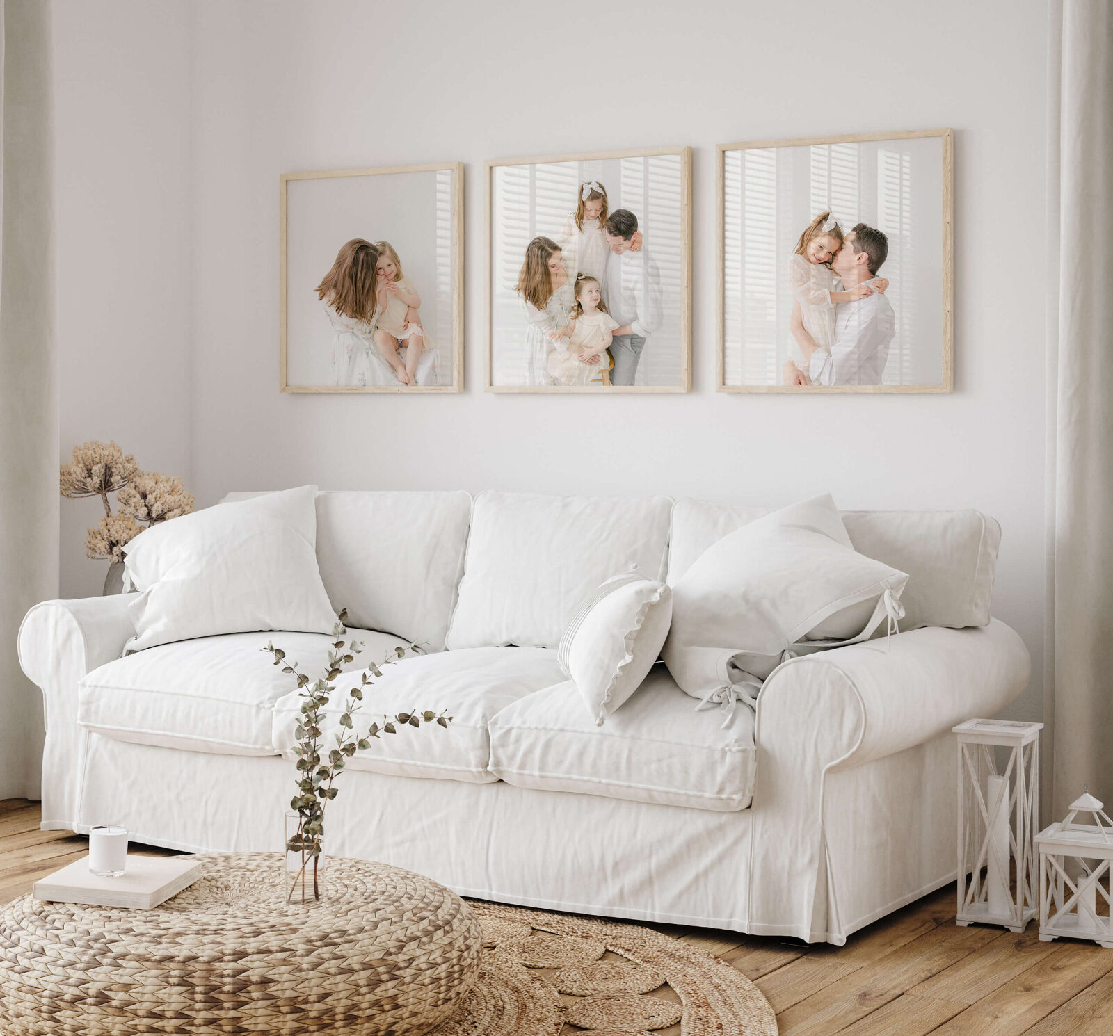 Local Omaha family displays their framed artwork above a white couch